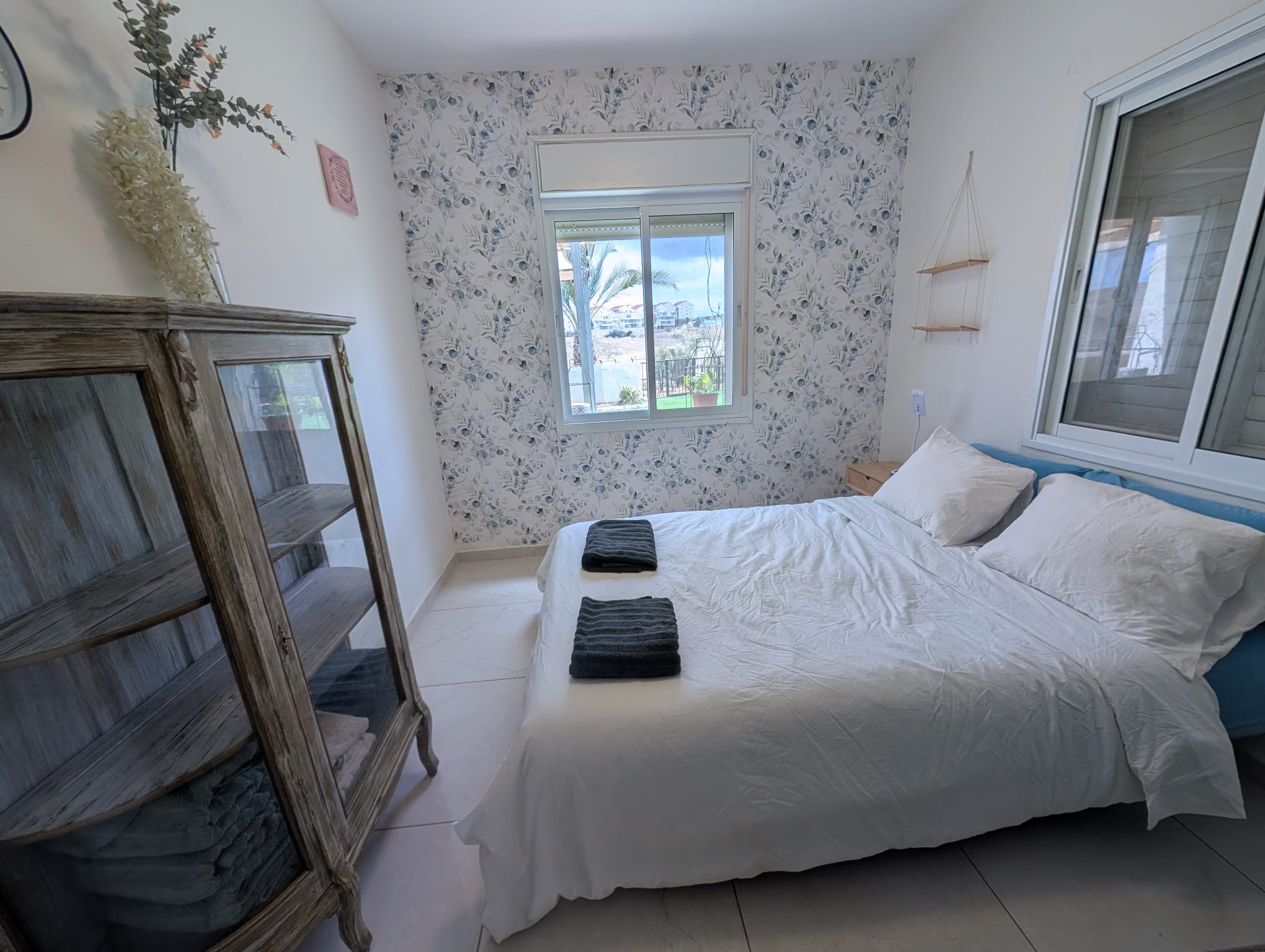 Bedroom with floral wall